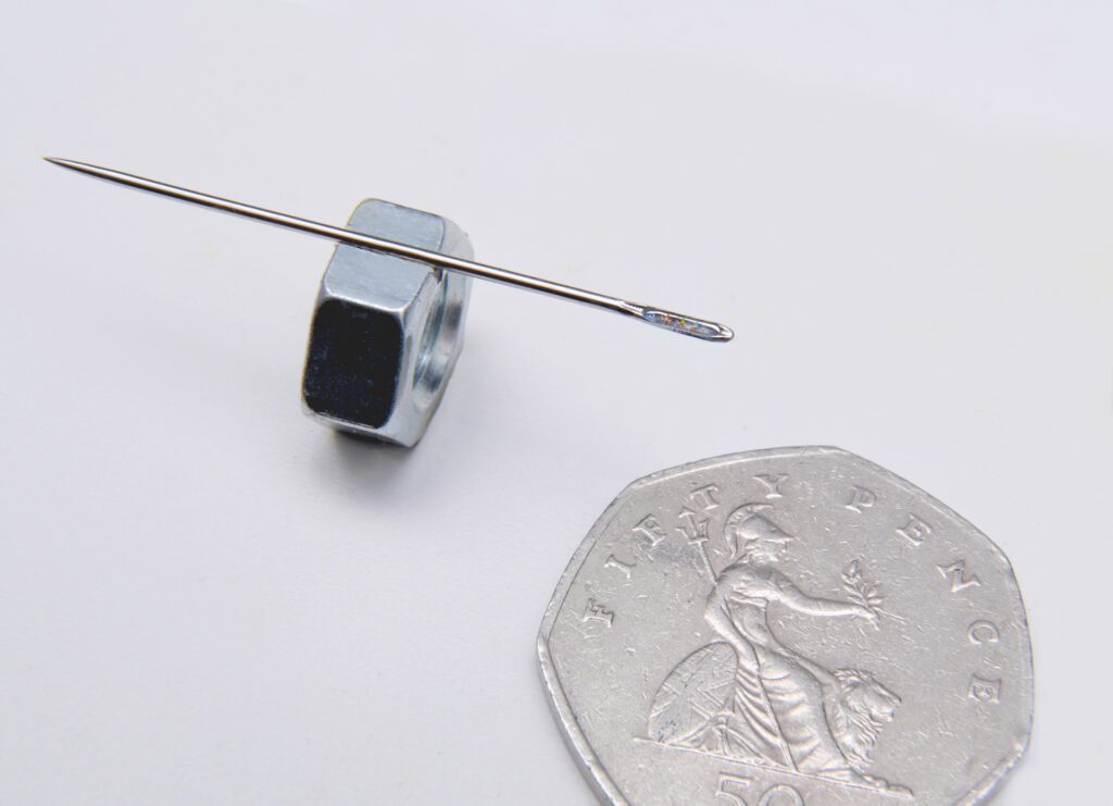 Three Little Kings in the Eye of a Needle an example with the actual needle to show size of art